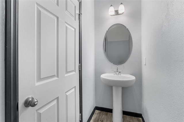 bathroom featuring hardwood / wood-style flooring and sink