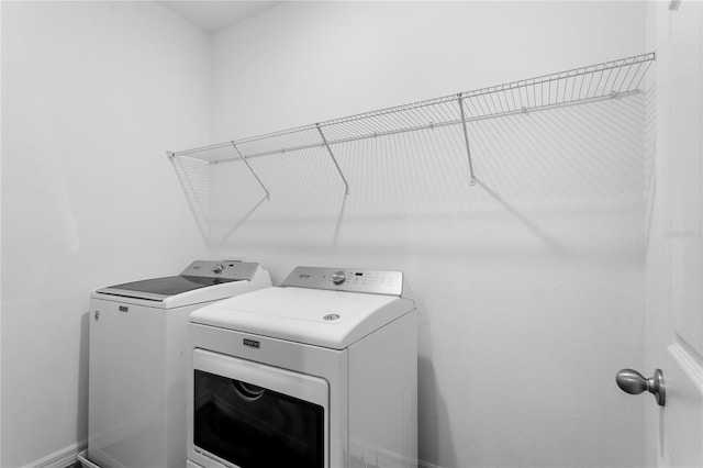 laundry area featuring washer and clothes dryer