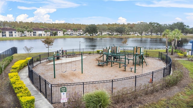 view of jungle gym featuring a water view