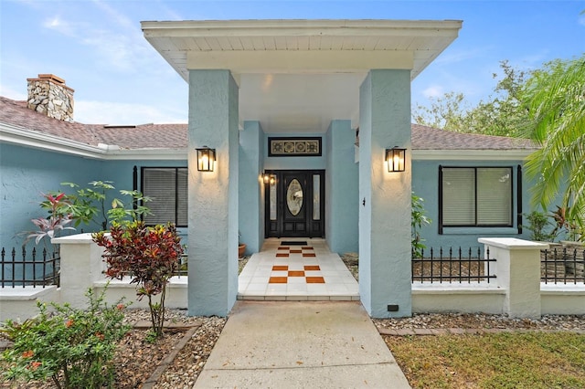 5016 Dorman Rd, Lakeland, FL 33813 - property entrance featuring stucco siding and roof with shingles