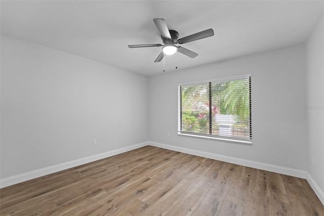 spare room featuring ceiling fan and light hardwood / wood-style flooring