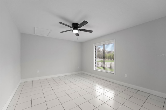 tiled spare room featuring ceiling fan