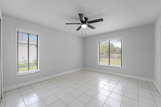 tiled empty room with ceiling fan