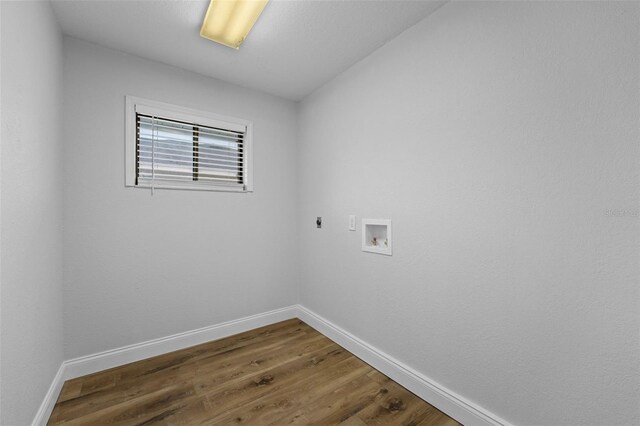 5016 Dorman Rd, Lakeland, FL 33813 - laundry area featuring hookup for an electric dryer, hookup for a washing machine, and wood finished floors