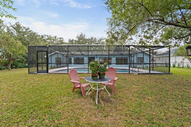 5016 Dorman Rd, Lakeland, FL 33813 - back of property with an outdoor pool, a yard, and glass enclosure