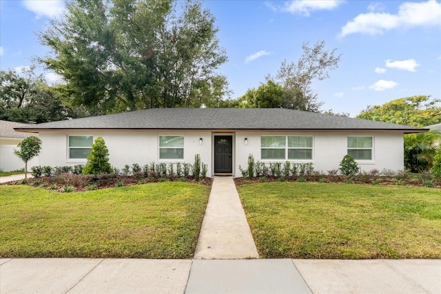 ranch-style home featuring a front yard