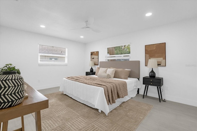 bedroom featuring multiple windows and ceiling fan