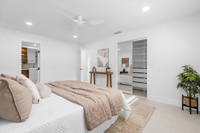 bedroom featuring ceiling fan, connected bathroom, and a closet