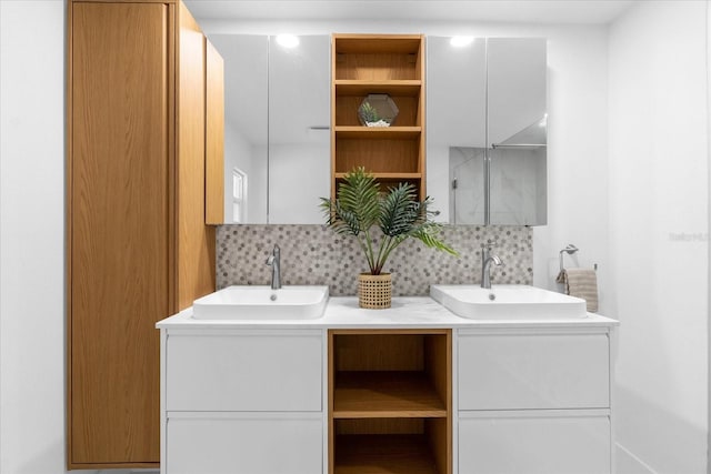 bathroom featuring decorative backsplash and vanity