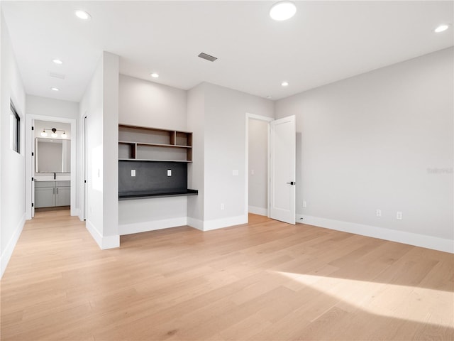 unfurnished living room featuring light hardwood / wood-style flooring