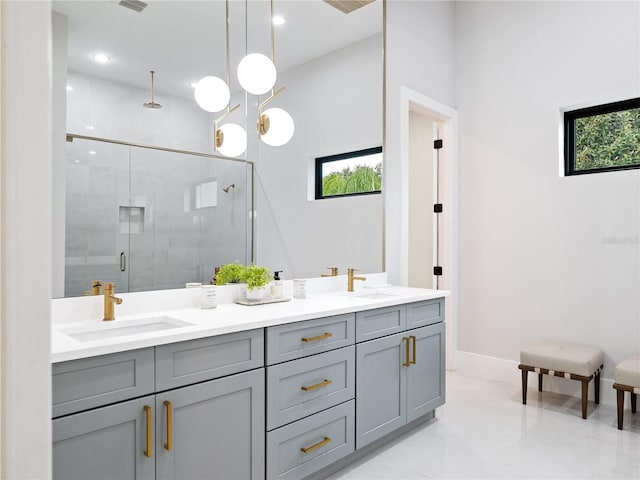 bathroom with walk in shower and vanity