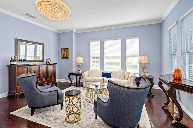 living room featuring crown molding, dark hardwood / wood-style flooring, and a healthy amount of sunlight