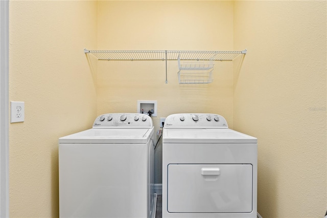 laundry room featuring washing machine and dryer