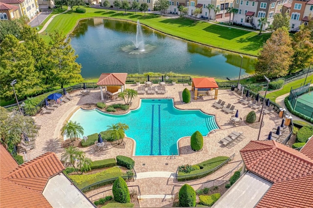 view of swimming pool with a gazebo and a water view