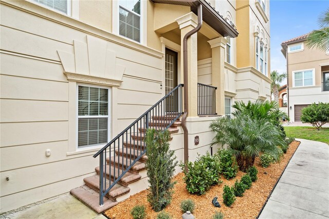 doorway to property with stucco siding