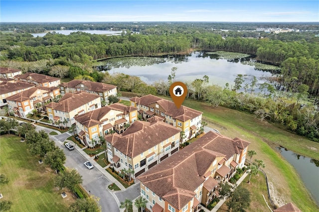 bird's eye view featuring a water view, a residential view, and a view of trees