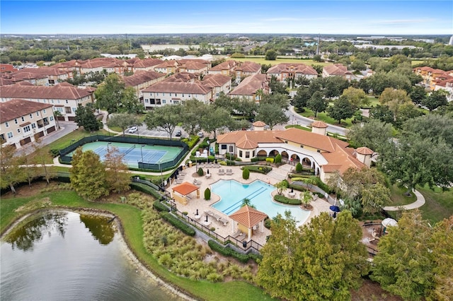 drone / aerial view featuring a water view and a residential view