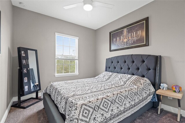 bedroom featuring carpet floors, a ceiling fan, and baseboards