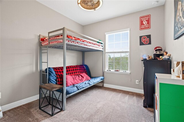 carpeted bedroom with baseboards