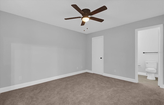 unfurnished bedroom featuring carpet flooring, ceiling fan, and ensuite bathroom