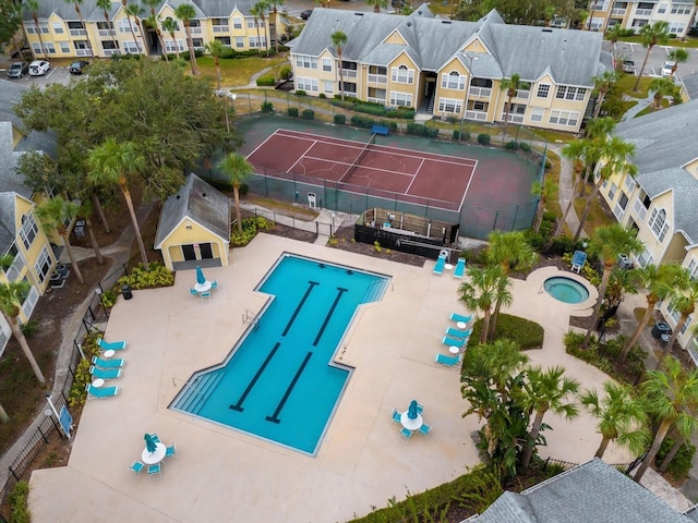 view of pool featuring tennis court