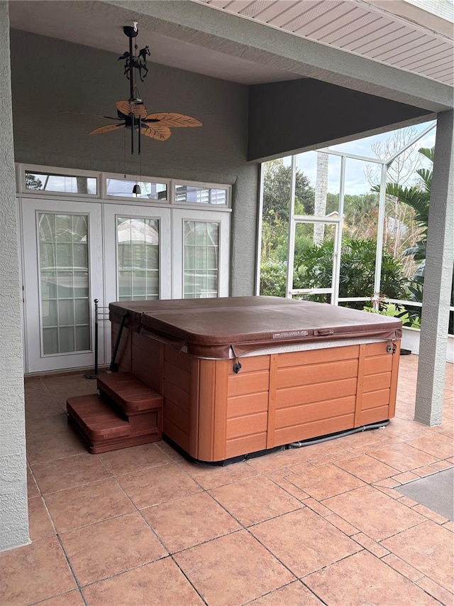 sunroom featuring vaulted ceiling, ceiling fan, and a hot tub