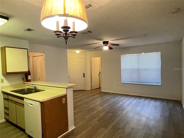 kitchen featuring kitchen peninsula, dark hardwood / wood-style flooring, dishwasher, and sink