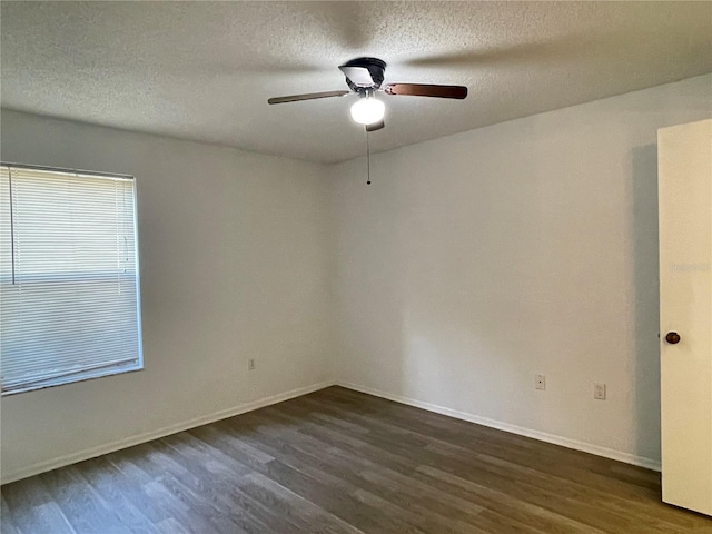 unfurnished room featuring a textured ceiling, dark hardwood / wood-style flooring, and ceiling fan