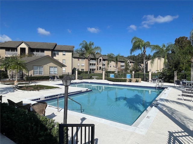 view of swimming pool with a patio