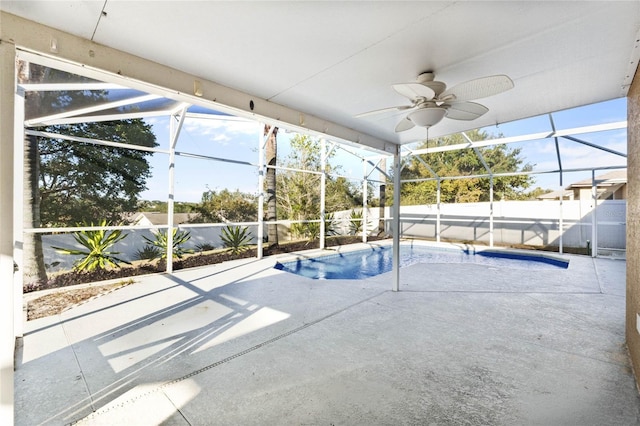 view of pool with a lanai, ceiling fan, and a patio