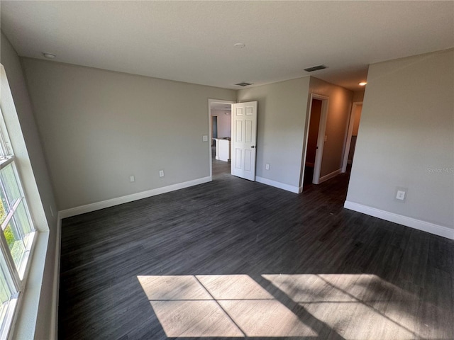 empty room featuring dark hardwood / wood-style floors