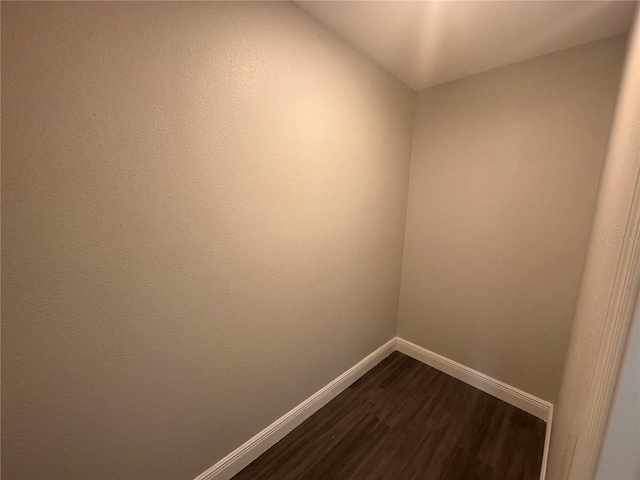 empty room with hardwood / wood-style flooring