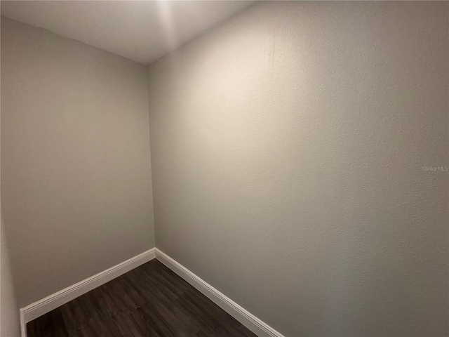 empty room featuring hardwood / wood-style flooring