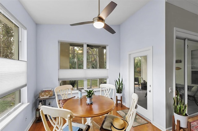 sunroom / solarium featuring ceiling fan and lofted ceiling