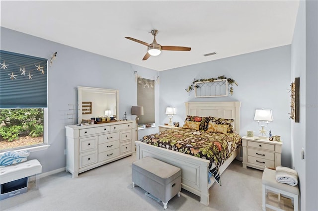 bedroom featuring ceiling fan and light colored carpet