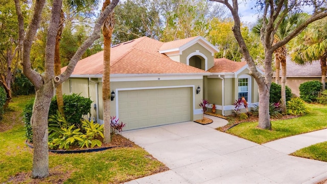 view of front facade featuring a garage and a front yard