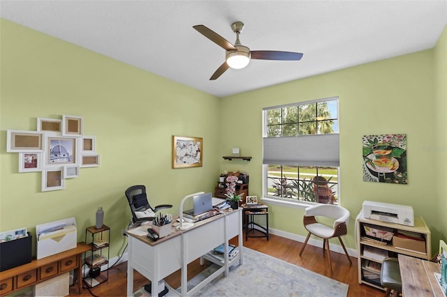 office with wood-type flooring and ceiling fan