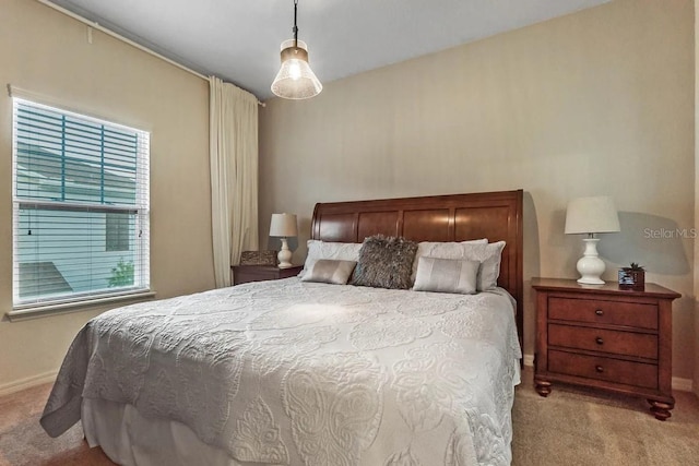 bedroom featuring light carpet