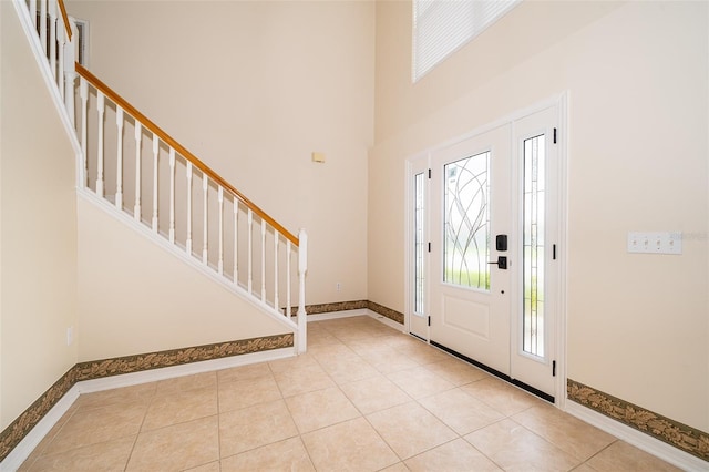 foyer featuring light tile patterned floors