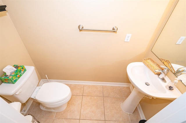 bathroom featuring tile patterned floors and toilet