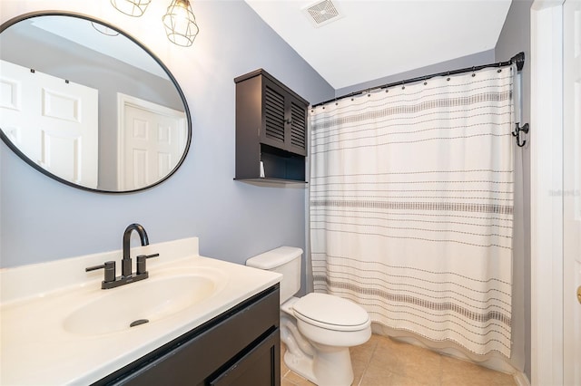 bathroom with tile patterned flooring, vanity, curtained shower, and toilet