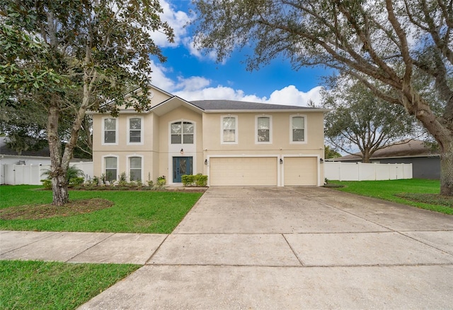 view of front of house featuring a front yard and a garage