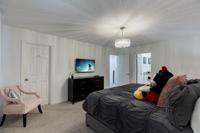 carpeted bedroom with a textured ceiling and an inviting chandelier