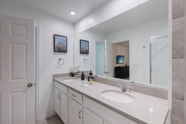 bathroom featuring vanity and a textured ceiling