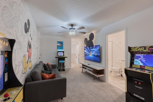 carpeted living room with a textured ceiling and ceiling fan