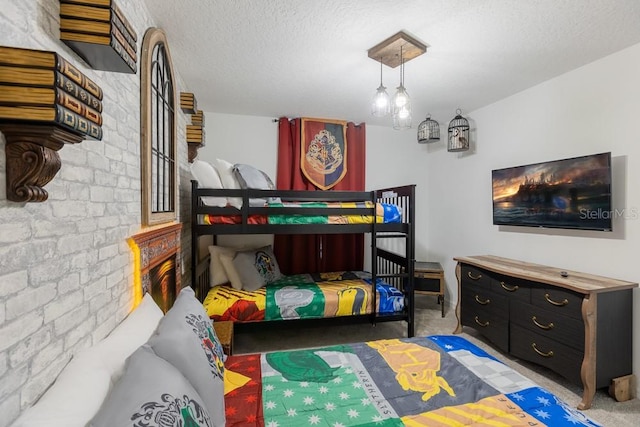 carpeted bedroom with a textured ceiling