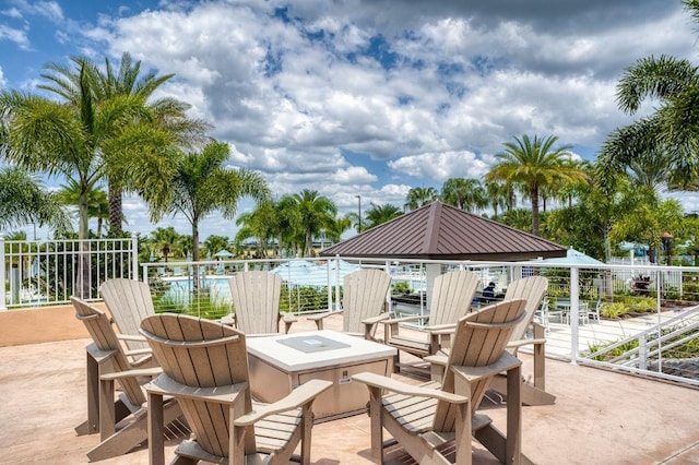 view of patio / terrace featuring a gazebo and a fire pit