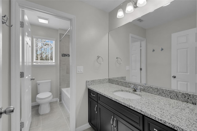 full bathroom with toilet, vanity, tile patterned floors, and tiled shower / bath