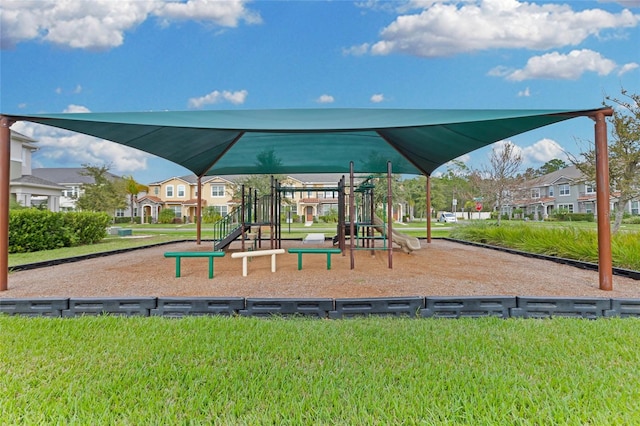 view of jungle gym featuring a lawn