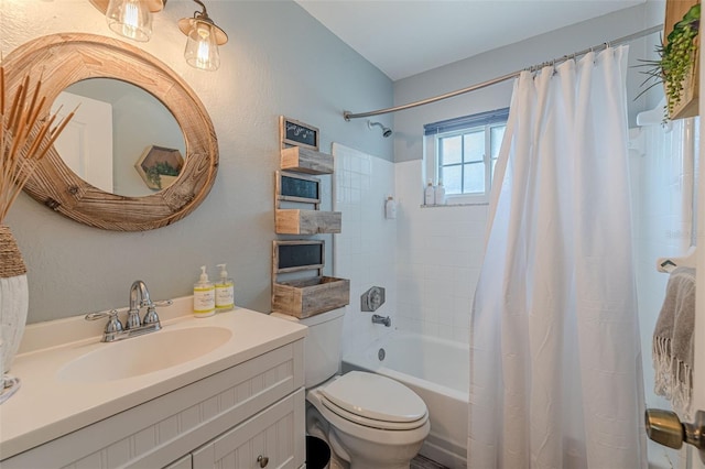 full bathroom featuring shower / bath combo with shower curtain, vanity, and toilet